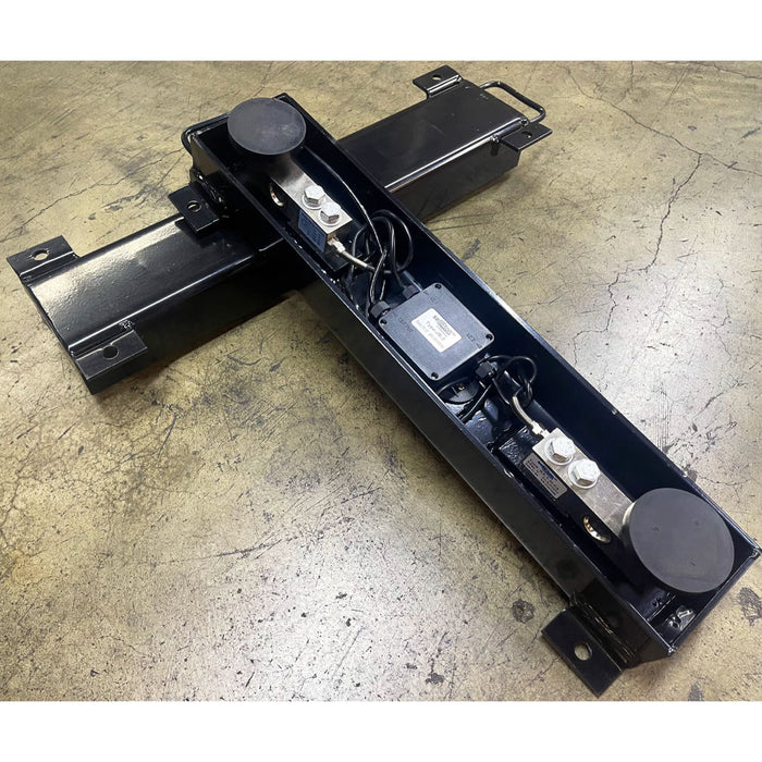front and back side view of weigh beams where 2 load cells, feet and junction box are installed for industrial and livestock weighing.